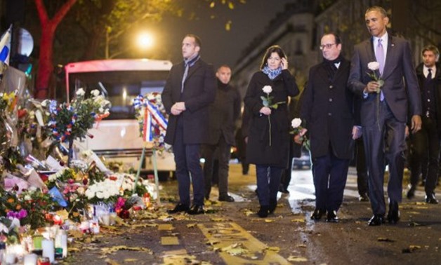Barack Obama's visit to the French capital will reunite him with former French president François Hollande and Paris Mayor Anne Hidalgo, two years after they paid their respects to the victims of the 2015 Paris attacks - AFP/Jim Watson
