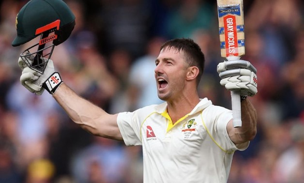 Shaun Marsh celebrates his century against England at Adelaide (AFP Photo/William WEST)
