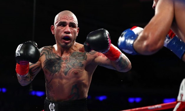 Before adoring fans at Madison Square Garden 37-year-old Miguel Cotto just didn't have enough against his 29-year-old opponent Sadaam Ali during their Junior Middleweight bout (AFP Photo/AL BELLO)
