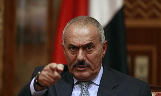Yemen's President Ali Abdullah Saleh points during an interview with selected media, including Reuters, in Sanaa in this May 25, 2011 file photo. Saleh said on December 24, 2011 he would go to the United States in order to allow an interim government to p