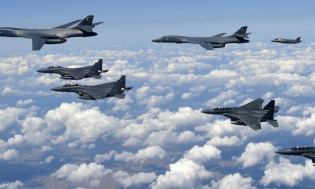 This September 18, 2017 South Korean Defence Ministry handout photo shows USAF B-1B Lancer bombers (L), US F-35B stealth jet fighters (far R) and S. Korean F-15K fighter jets (foreground) over South Korea. -  AFP Photo / South Korean Defence Ministry