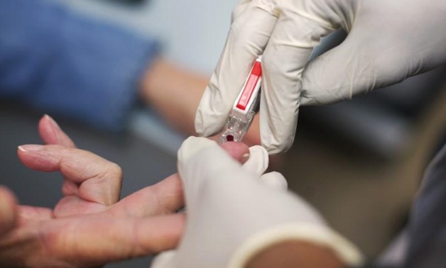 Patient Eilleen Corrigin has blood drawn at an anti-coagulation clinic at the Staten Island University Hospital in Staten Island, New York May 7, 2012. REUTERS/Allison Joyce
