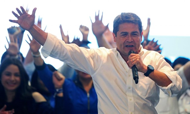 Honduras President Juan Orlando Hernandez celebrates with supporters as he cited exit polls to declare himself winner in the presidential election in Tegucigalpa, Honduras, November 26, 2017. REUTERS/Edgard Garrido
