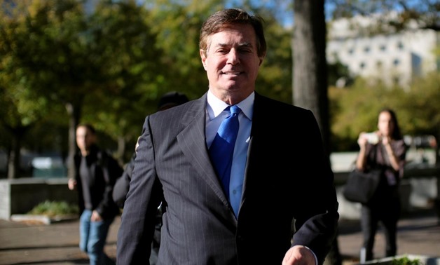 FILE PHOTO: Former Trump 2016 campaign chairman Paul Manafort leaves U.S. Federal Court, after being arraigned on twelve federal charges in the investigation into alleged Russian meddling in the 2016 U.S. presidential election, in Washington, U.S. October
