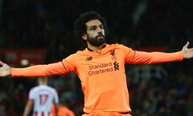 © AFP/File / by Tom WILLIAMS | Liverpool's Mohamed Salah continues to dazzle by scoring 12 goals in his first 15 Premier League appearances for the club
