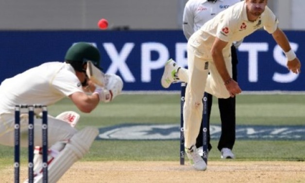 England paceman James Anderson (R) sends down a bouncer to Australia's Pat Cummins on the way to capturing five wickets on the fourth day of the second Ashes Test - AFP