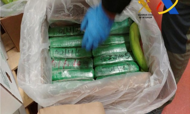 Spanish police display packages of cocaine which were seized in a shipment of bananas from Colombia in a container in the port of Algeciras, Spain in this undated handout photo released December 5, 2017. Guardia Civil-Ministerio del Interior/Handout - REU