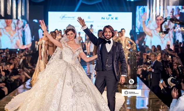 Actress Yousra El Lozy dressed in the Egypt’s most expensive Egyptian wedding dress during the fashion show –Hany El-Behairy official Facebook page