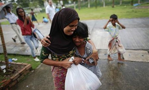 Narunisa, a 25-year-old Rohingya woman, is reunited with her children after returning to a shelter for Rohingya women and children in Phang Nga June 18, 2013. REUTERS/Damir Sagolj
