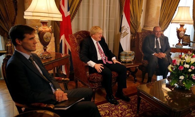 Egyptian foreign minister Sameh Shoukry (R) meets with British Foreign Secretary Boris Johnson (C) at Tahrir Palace in Cairo, Egypt February 25, 2017. REUTERS/Amr Abdallah Dalsh

