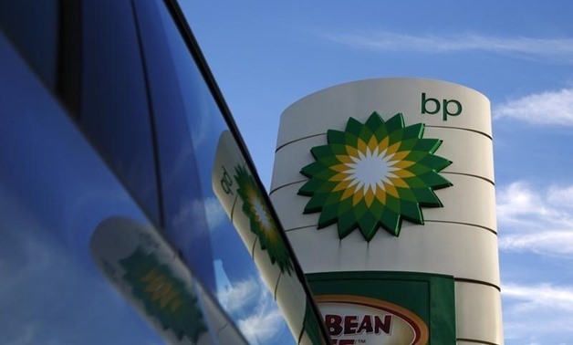 Reuters- Luke MacGregor- BP logo is reflected in a car window at a petrol station in London