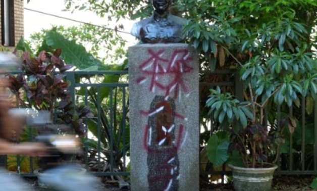 © AFP / by Michelle YUN | A statue of Taiwan's Chiang Kai-shek defaced with the word "murderer"

