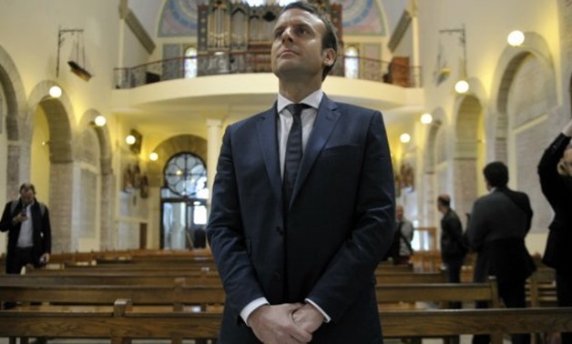 © AFP | Emmanual Macron in the Notre Dame d'Afrique catherdal in Algiers on February 14, 2017