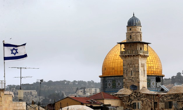 FILE - Israeli flag has been raised the area surrounding the Dome of the Rock mosque 