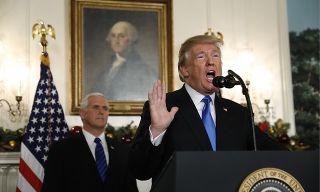 With Vice Pence Mike Pence looking on, U.S. President Donald Trump gives a statement on Jerusalem, during which he recognized Jerusalem as the capital of Israel, in the Diplomatic Reception Room of the White House in Washington, U.S., December 6, 2017. RE