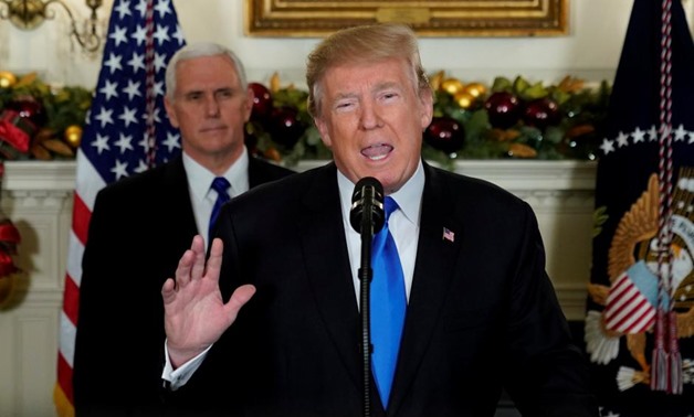 U.S. President Donald Trump, flanked by ‪Vice President Mike Pence‬, delivers remarks recognizing Jerusalem as the capital of Israel at the White House in Washington, U.S. December 6, 2017. REUTERS/Jonathan Ernst
