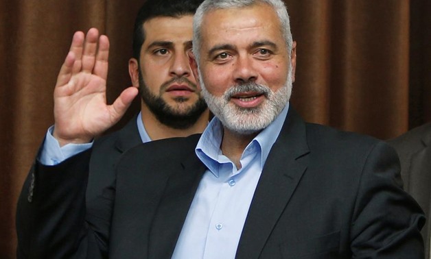 Senior Hamas leader Ismail Haniyeh waves as he arrives to deliver a farewell speech for his former position as a Hamas government Prime Minister, in Gaza City June 2, 2014. REUTERS/Suhaib Salem