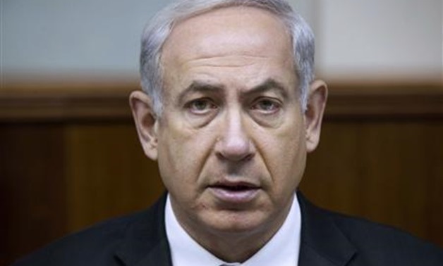 Israel's Prime Minister Benjamin Netanyahu attends the weekly cabinet meeting in Jerusalem June 16, 2013. REUTERS/Uriel Sinai/Pool
