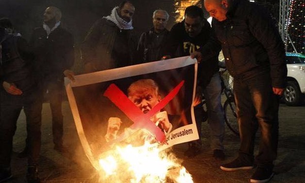 Palestinians burn photos of Trump as he is expected to name Jerusalem as Israel's capital, musaalshaer, AFP