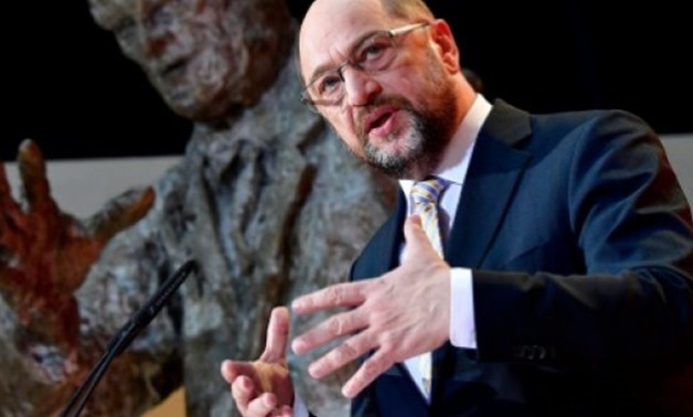 © AFP/File / by Frank ZELLER | Martin Schulz has vowed to extract maximum concessions for his Social Democrats in exchange for creating a coalition government with German Chancellor Angela Merkel
