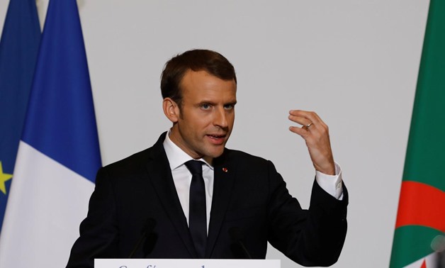 French President Emmanuel Macron gestures during his news conference in Algiers, Algeria December 6, 2017. REUTERS/Zohra Bensemra
