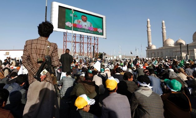 Shiite Huthis watch a live speech by their leader Abdul-Malik al-Houthi on - REUTERS
