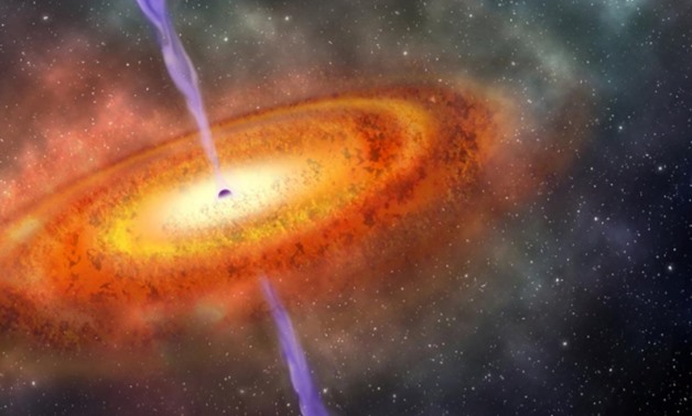 Artist's conception of the most-distant supermassive black hole ever discovered, which is part of a quasar from just 690 million years after the Big Bang is shown in this illustration released on December 6, 2017. Courtesy Robin Dienel/Carnegie Institutio