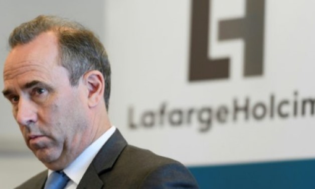© AFP/File | Eric Olsen, who served as CEO of France's LafargeHolcim from 2015-2017, has been charged with "financing of a terrorist organisation" and "endangering the lives of others"
