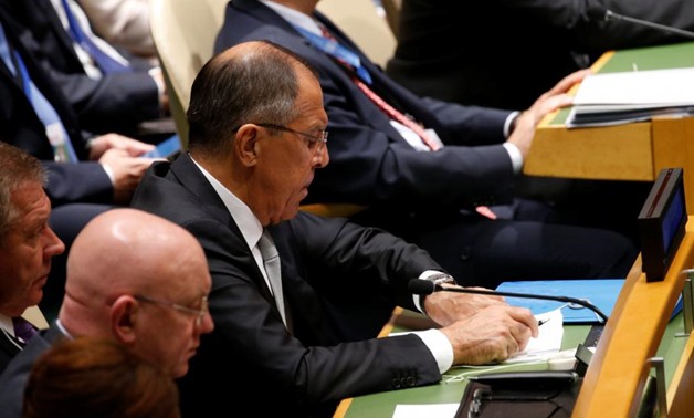 Russian Foreign Minister Sergei Lavrov checks his watch as U.S. President Donald Trump delivers his address to The United Nations General Assembly in New York, U.S., September 19, 2017. REUTERS/Kevin Lamarque