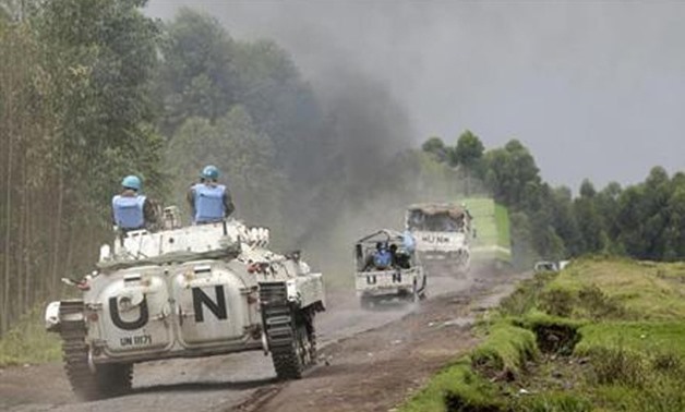 File Photo: UN peacekeepers drive their tank as they patrol past the deserted Kibati village near Goma in the eastern Democratic Republic of Congo, August 7, 2013. Reuters