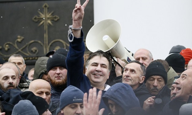 Georgian former President Mikheil Saakashvili flashes a victory sign after he was freed by his supporters in Kiev, Ukraine December 5, 2017. — Reuters
