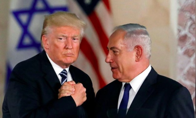 U.S. President Donald Trump and Israeli Prime Minister Benjamin Netanyahu shake hands after Trump's address at the Israel Museum in Jerusalem May 23, 2017 -
 REUTERS/Ronen Zvulun