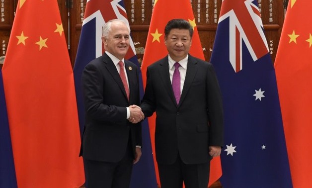 Australia's Prime Minister Malcolm Turnbull, seen here with Chinese President Xi Jinping, told Beijing he was merely defending Australian interests after a row over alleged foreign interference - AFP