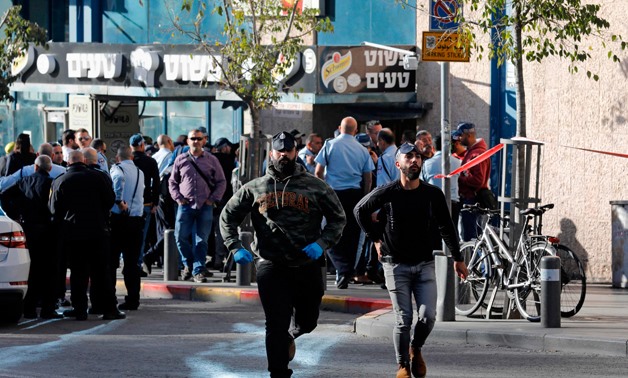 Israeli police gather at the entrance of the central bus station in Jerusalem following a reported stabbing attack on December 10, 2017