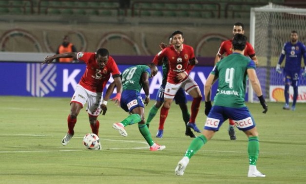 Al-Ahly`s Junior Ajaye beats Misr Al-Makasah`s John Antwi in their clash at The New Suez stadium – File Photo