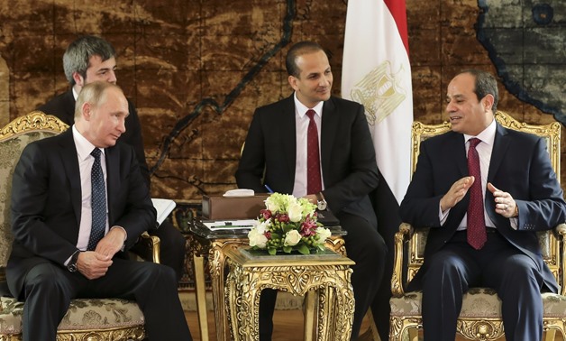Russia's President Vladimir Putin (L) meets with Egypt's President Abdel Fattah al-Sisi (R) in Cairo, Egypt December 11, 2017 - REUTERS/Alexander Zemlianichenko/Pool