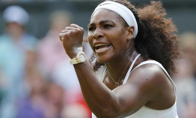 Serena Williams of the U.S.A. celebrates winning a game during her match against Heather Watson of Britain at the Wimbledon Tennis Championships in London, July 3, 2015. REUTERS/Suzanne Plunkett