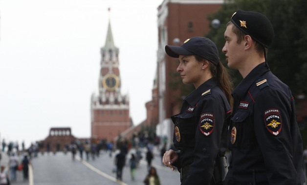 Interior Ministry officers patrol the city centre, with Red Square and the Kremlin wall seen in the background, in Moscow, Russia September 13, 2017. REUTERS/Sergei Karpukhin