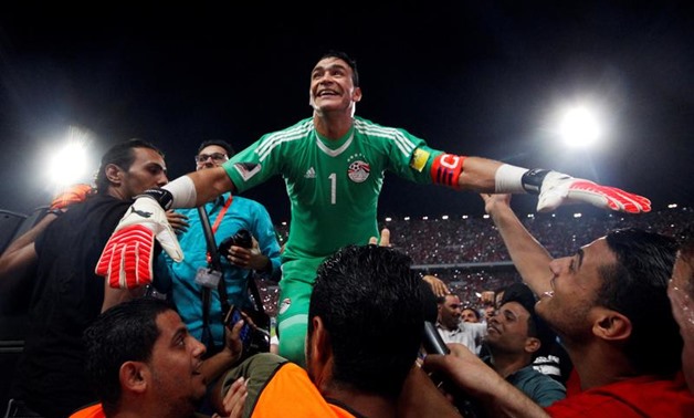 Egypt's Essam El Hadary and teammates celebrate World Cup qualification after the match. REUTERS/Amr Abdallah Dalsh