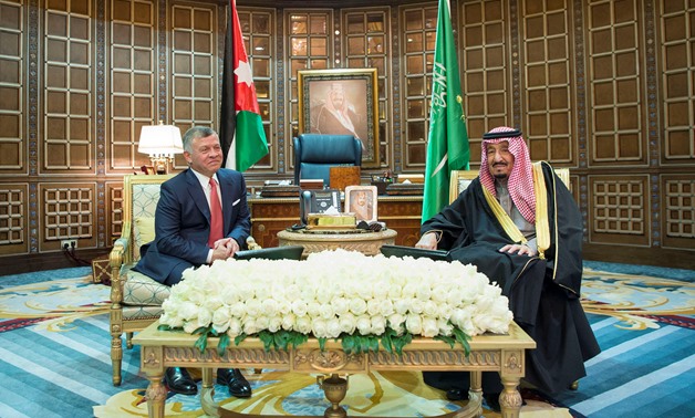 FILE- Saudi Arabia's King Salman bin Abdulaziz Al Saud meets with Jordan's King Abdullah II in Riyadh, December 12, 2017. Bandar Algaloud/Courtesy of Saudi Royal Court/Handout via REUTERS ATTENTION EDITORS 