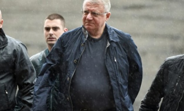 © AFP/File / by Jan HENNOP | The acquittal of Serbian ultranationalist Vojislav Seselj (C), pictured in 2015, is being challenged by UN prosecutors
