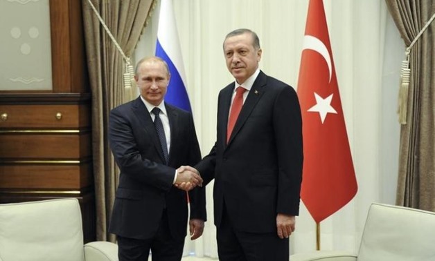 Russia's President Vladimir Putin (L) shakes hands with his Turkish counterpart Tayyip Erdogan during a meeting at the Presidential Palace in Ankara, December 1, 2014. REUTERS/Mikhail Klimentyev/RIA Novosti/Kremlin