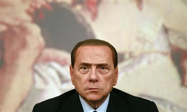 Italy's Prime Minister Silvio Berlusconi looks on during a news conference at Chigi Palace in Rome August 4, 2011. REUTERS/Tony Gentile