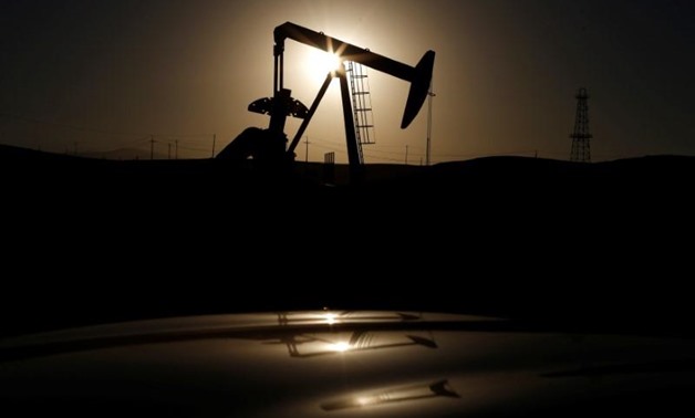 FILE PHOTO - A pump jack is seen at sunrise near Bakersfield, California October 14, 2014. REUTERS/Lucy Nicholson