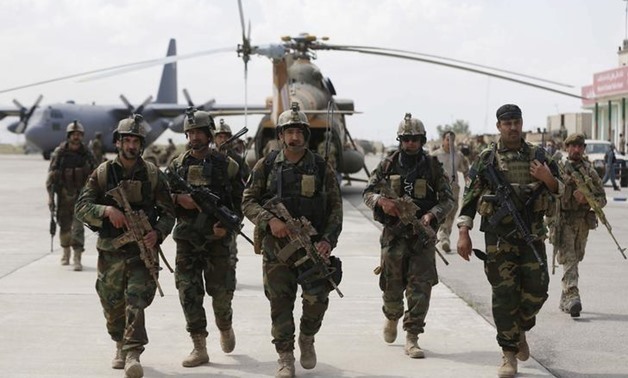 Afghan security forces arrive at the Kunduz airport in Afghanistan on April 30, 2015.
