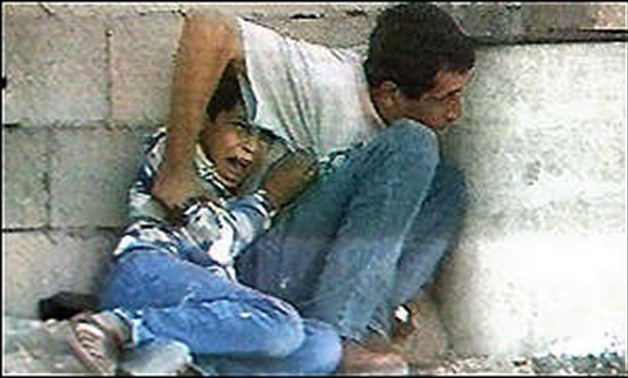 Jamal and Muhammad Al-Durrah being shot; Khan Yunis, Gaza Strip; September 30, 2000 - Wikipedia/ Alberuni