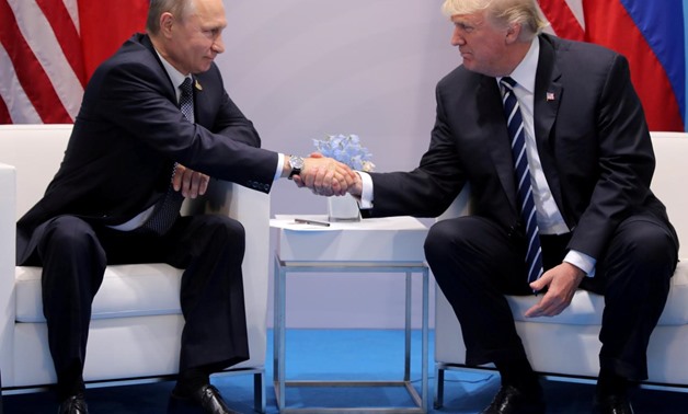 U.S. President Donald Trump shakes hands with Russia's President Vladimir Putin during their bilateral meeting at the G20 summit in Hamburg, Germany July 7, 2017. REUTERS/Carlos Barria