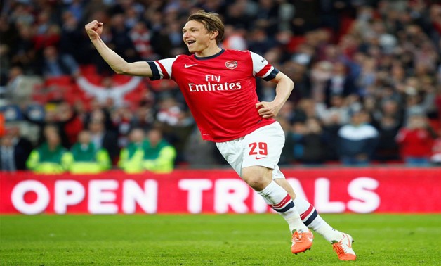 Arsenal's Kim Kallstrom celebrates after scoring a penalty in their penalty shoot-out during their English FA Cup semi-final soccer match against Wigan Athletic at Wembley Stadium in London April 12, 2014. REUTERS/Eddie Keogh/File Photo