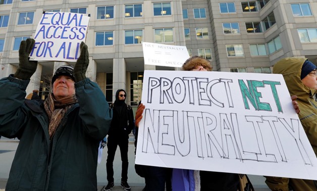 Net neutrality advocates rally in front of the Federal Communications Commission (FCC) ahead of Thursday's expected FCC vote repealing so-called net neutrality rules in Washington, U.S., December 13, 2017. REUTERS/Yuri Gripas