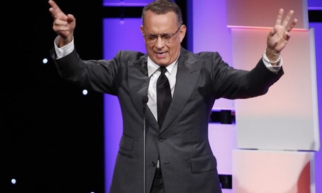 FILE - Actor Tom Hanks speaks on stage - REUTERS/Danny Moloshok